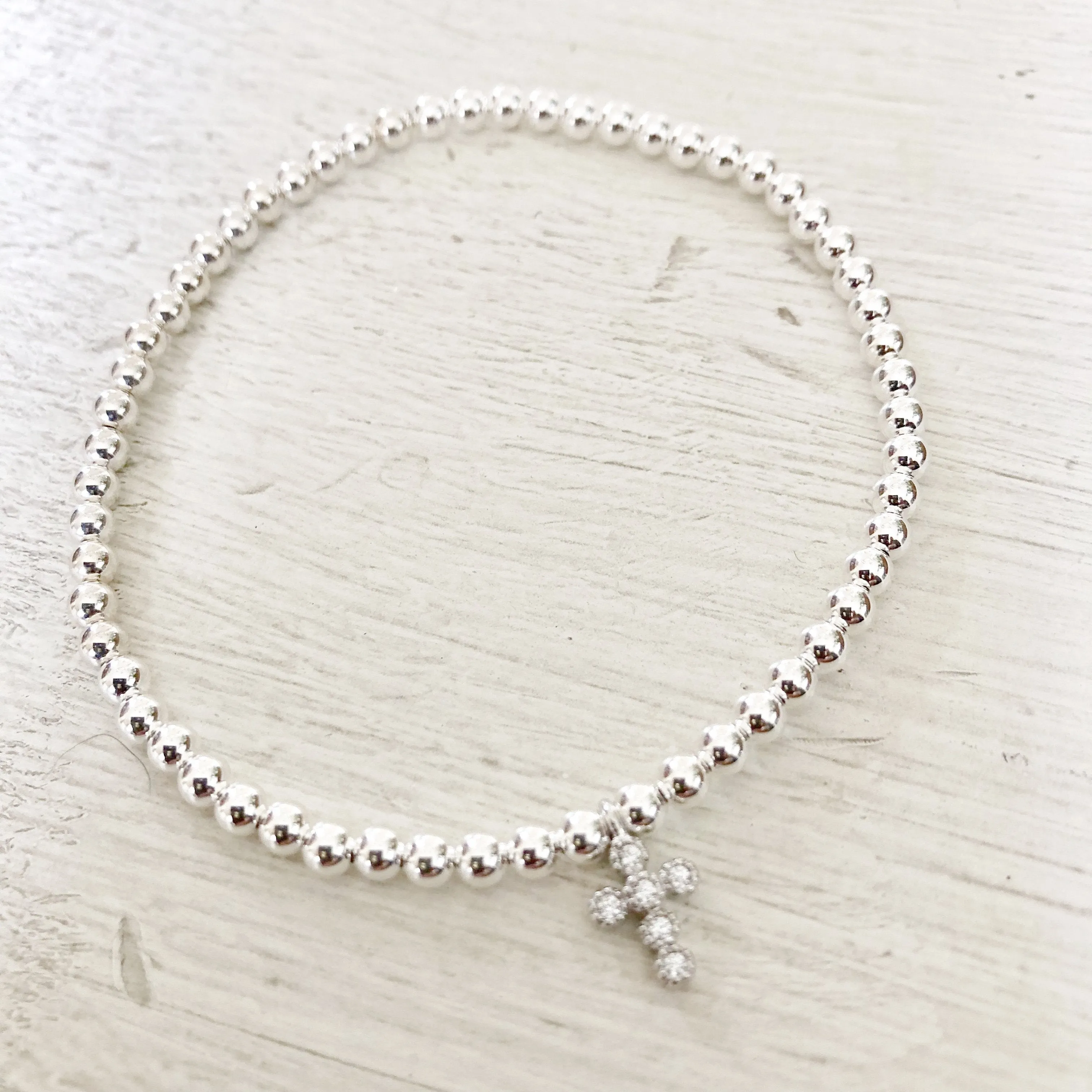 3mm Bead Stretch Bracelet with Matching Cubic Zirconia Cross Charm