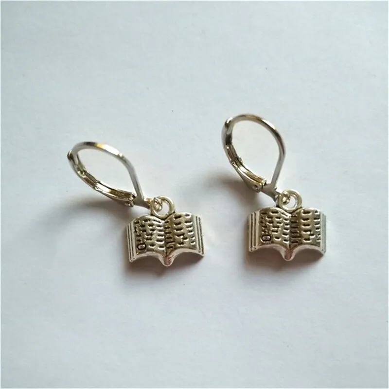 Earring with dangling books